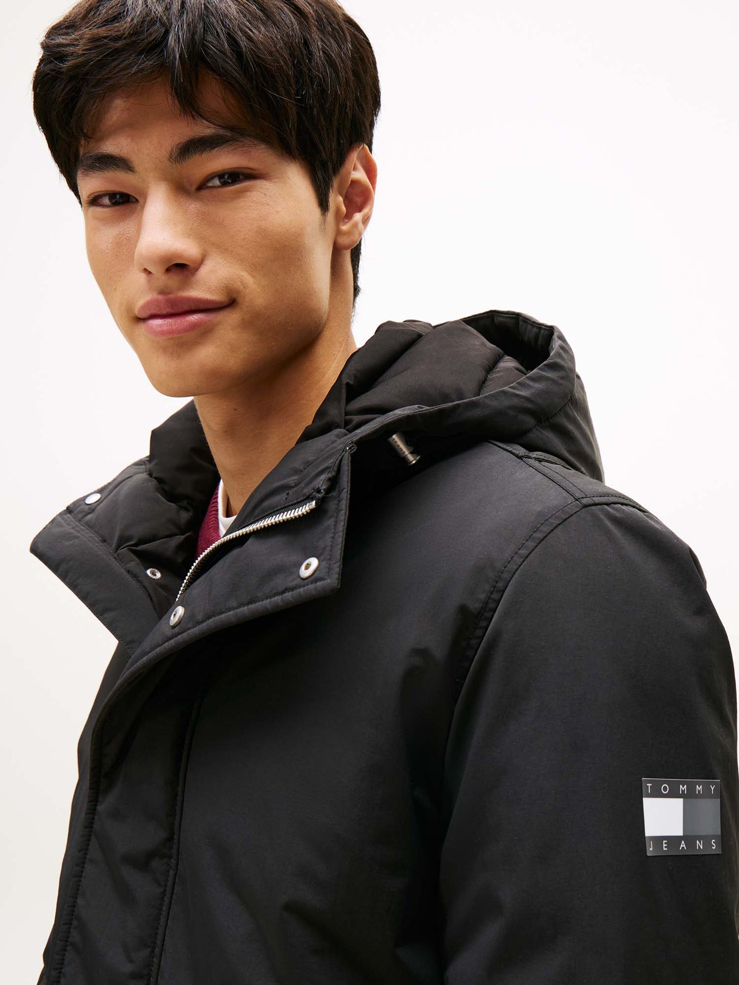 BOMBER CON CAPPUCCIO TOMMY JEANS DA UOMO NERO