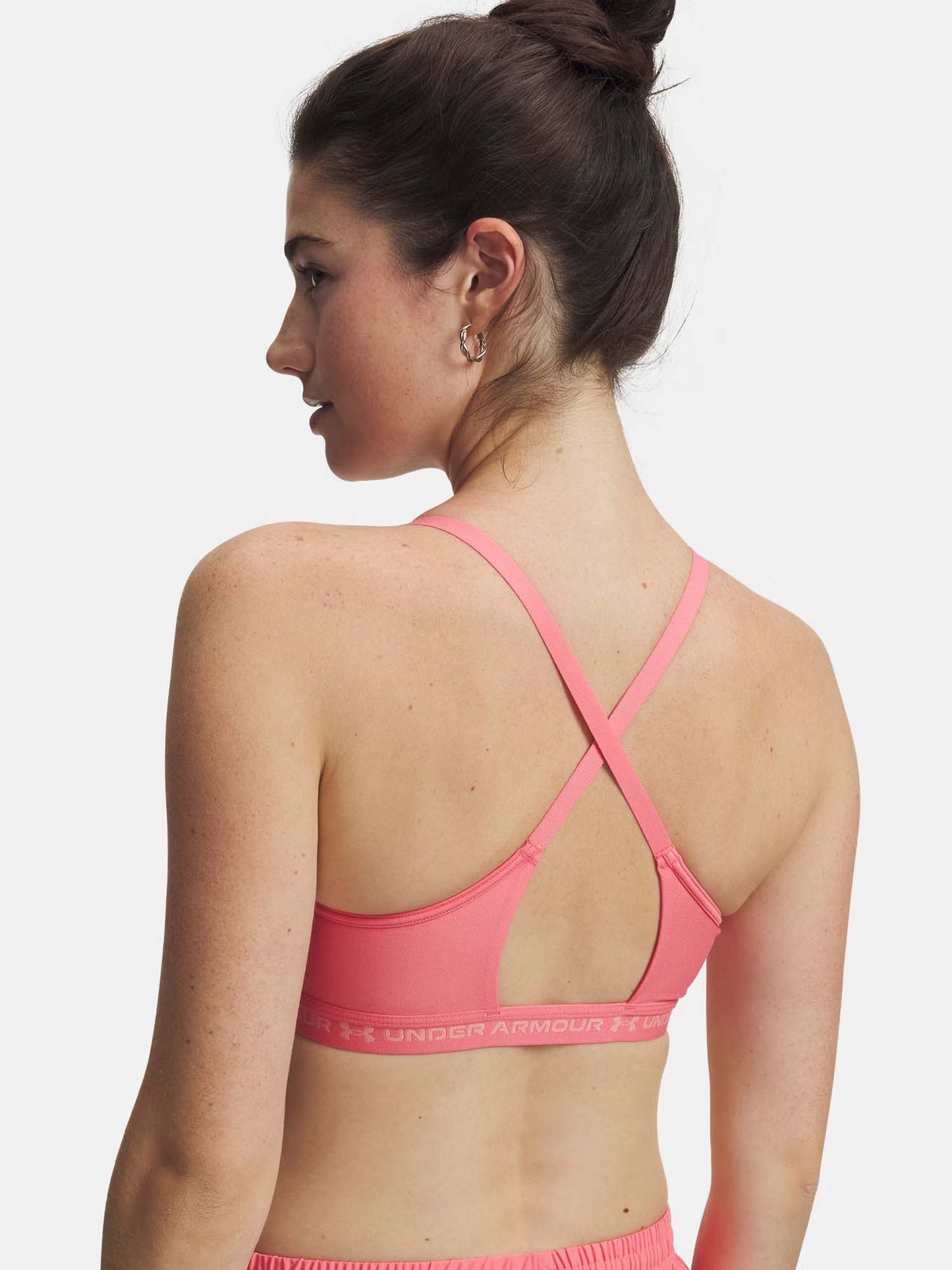 Under Armour Crossback Low, canotta sportiva donna fucsia con supporto leggero