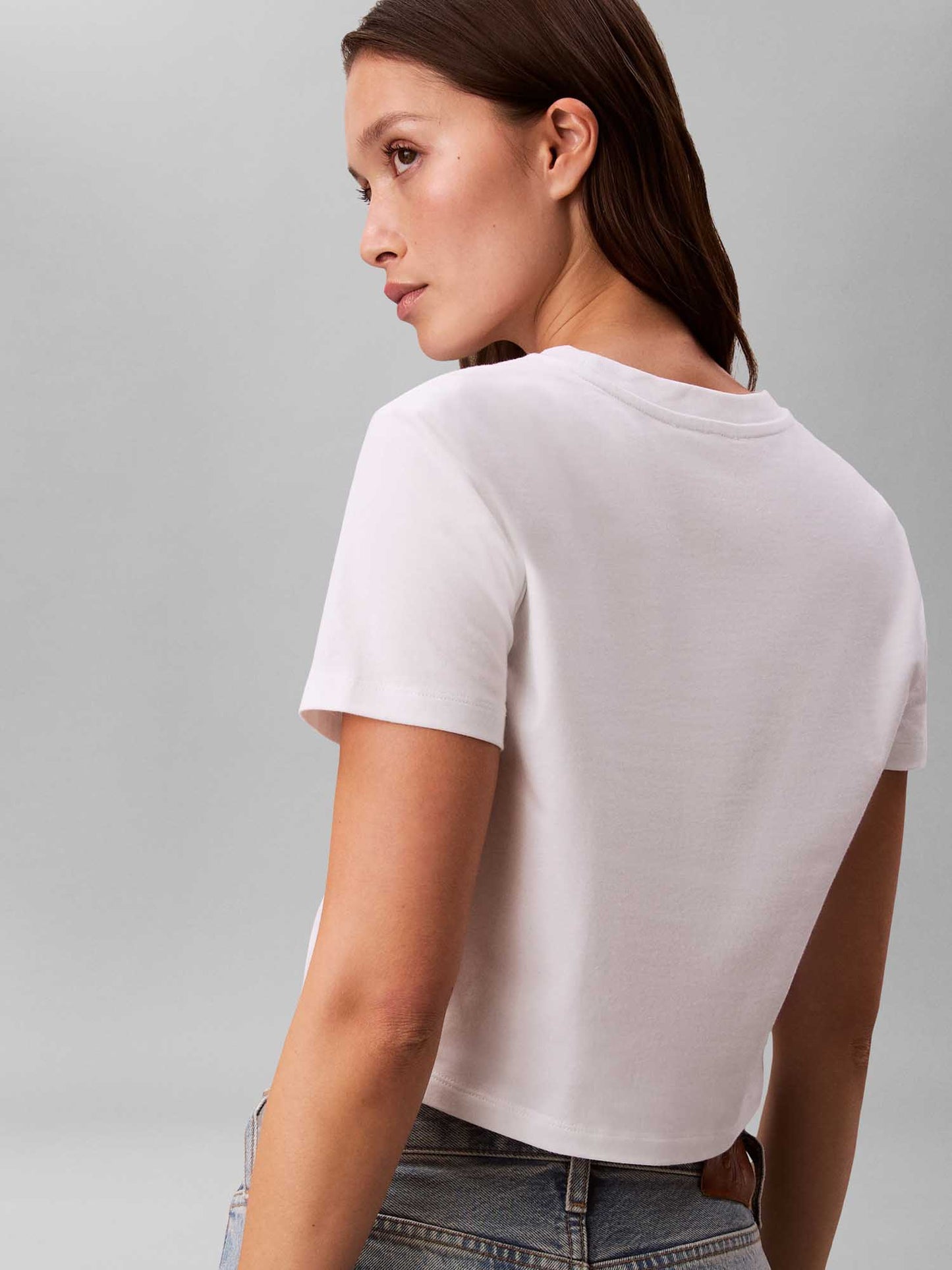 T-shirt bianca cropped Calvin Klein Jeans con logo da donna