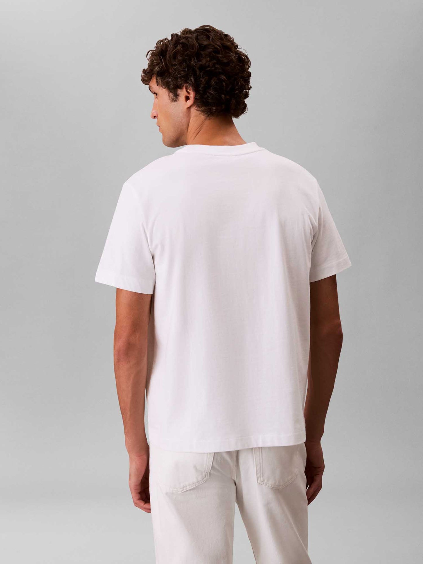 T-shirt bianca Calvin Klein Jeans con tasca logata da uomo