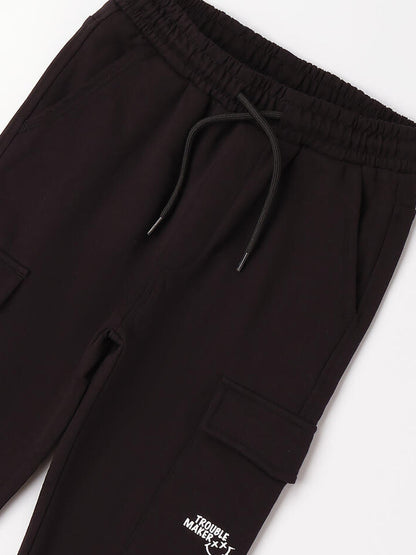Pantaloni cargo felpati da bambino unisex in nero Ido