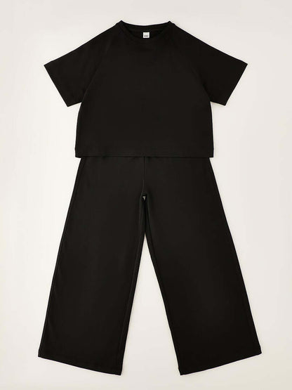 Ido tuta unisex bambino in nero, modello comodo e versatile