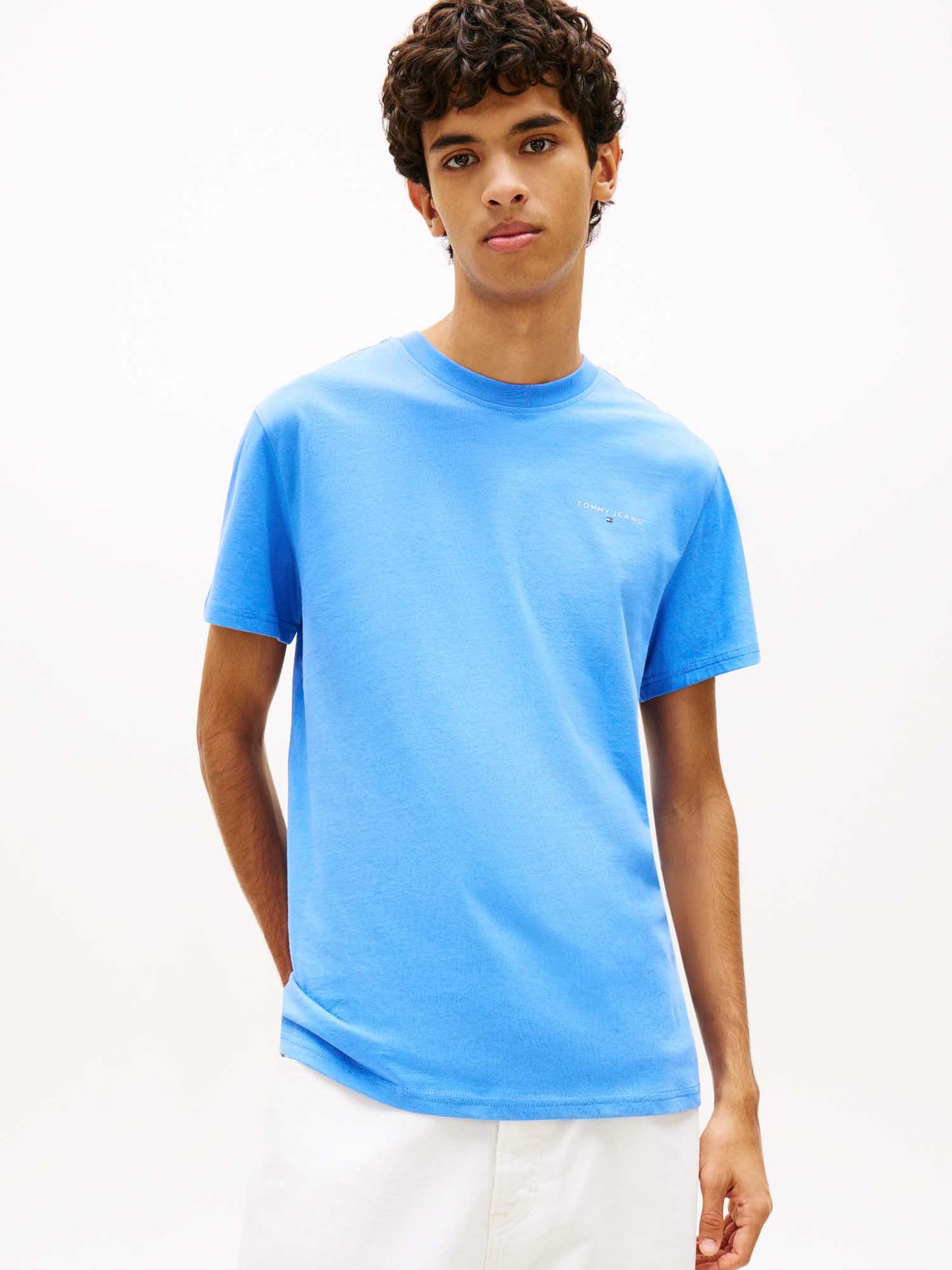 T-shirt girocollo slim fit azzurra Tommy Jeans con logo lineare