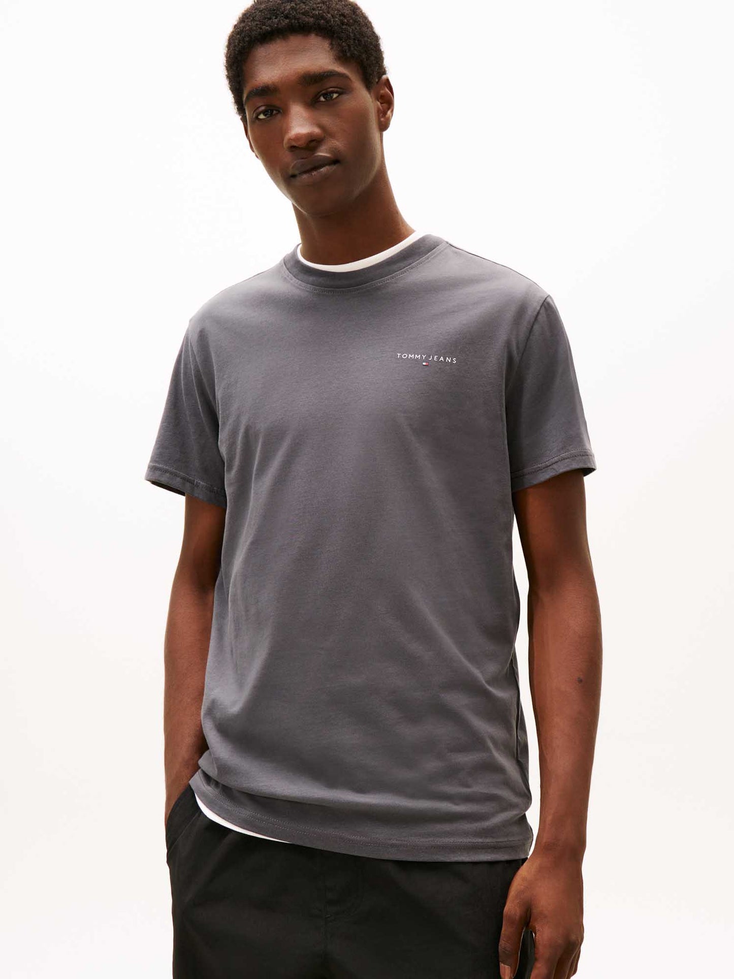 T-shirt girocollo grigia Tommy Jeans slim con logo lineare da uomo