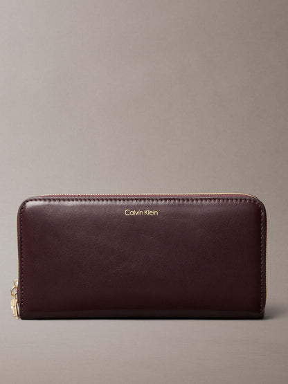 PORTAFOGLI  LARGE ZIP AROUND CALVIN KLEIN DONNA BORDEAUX