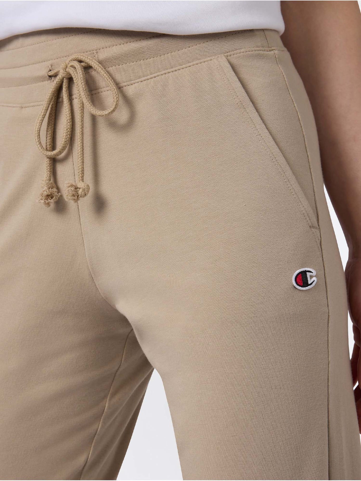 Pantaloni Champion da donna beige con polsino e lycra