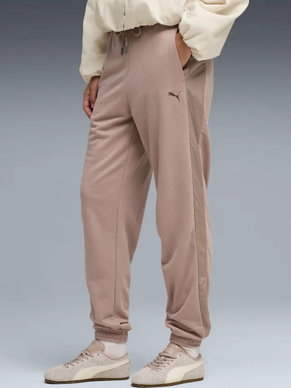 Pantaloni high-waist donna Puma HER beige dal design versatile