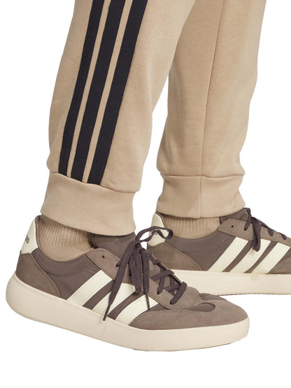 PANTALONE TUTA ESSENTIALS 3-STRIPES FLEECE ADIDAS DA UOMO NOCCIOLA