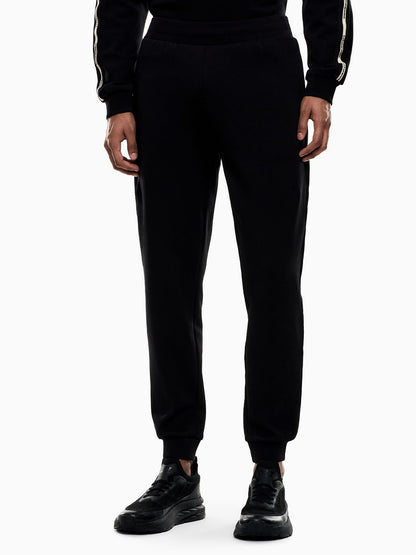 Pantaloni sportivi neri da uomo EA7 Emporio Armani dal design contemporaneo