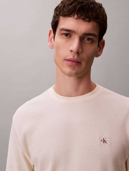 Maglia a maniche lunghe Calvin Klein Jeans panna con patch monogramma