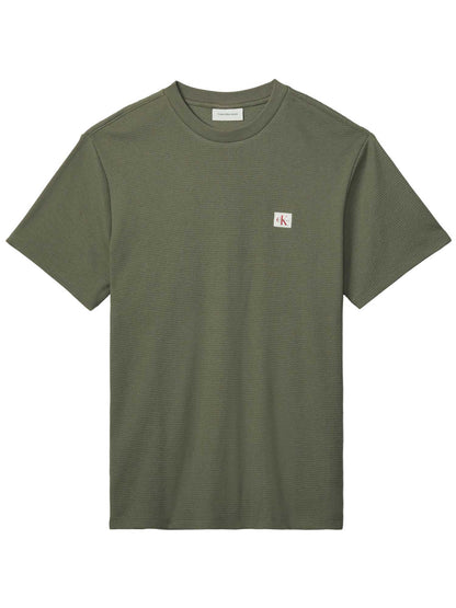 T-shirt verde Calvin Klein Jeans con badge a nido d'ape da uomo