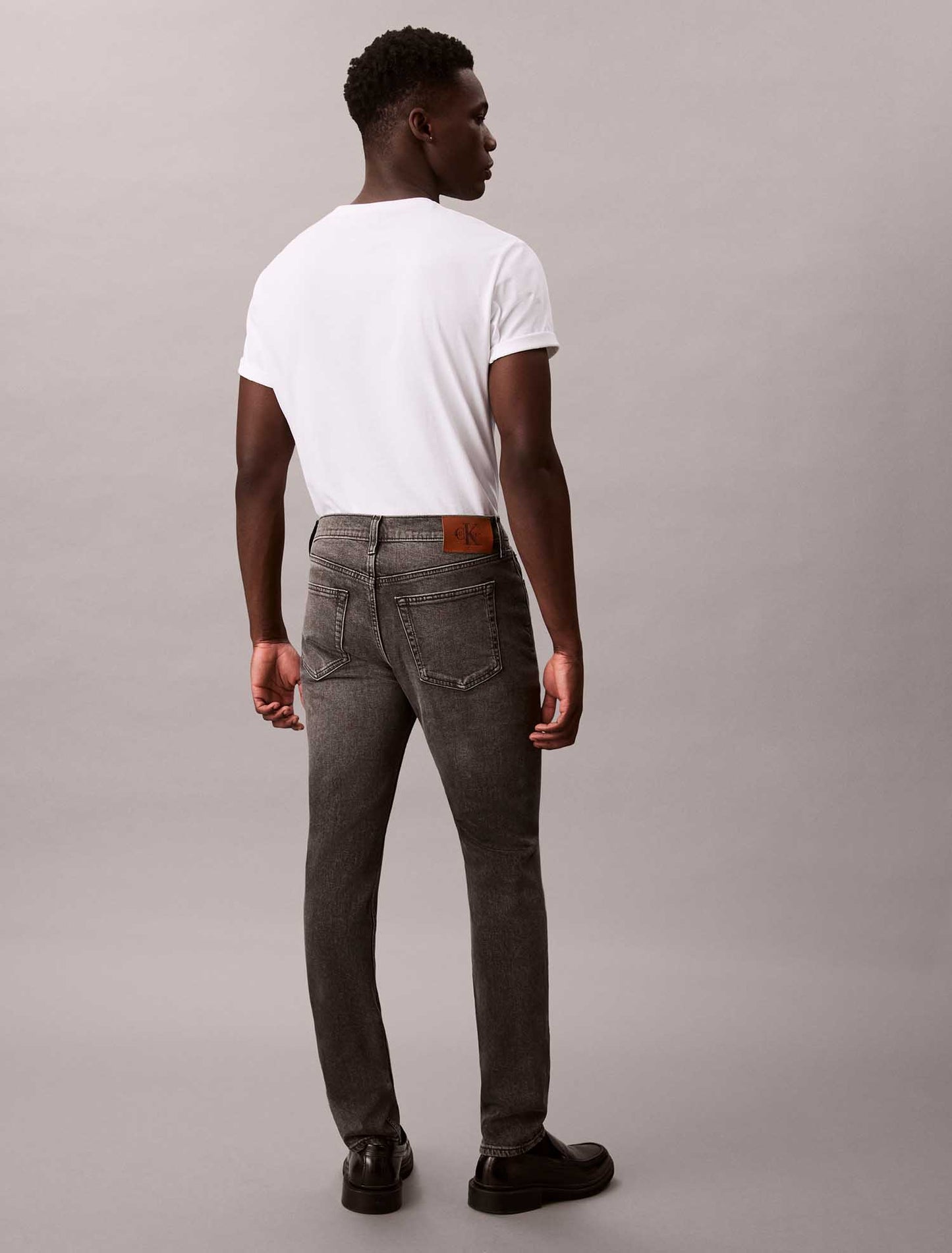 Jeans slim tapered Calvin Klein in cotone elasticizzato da uomo grigio