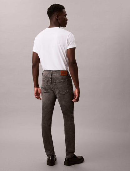 Jeans slim tapered Calvin Klein in cotone elasticizzato da uomo grigio