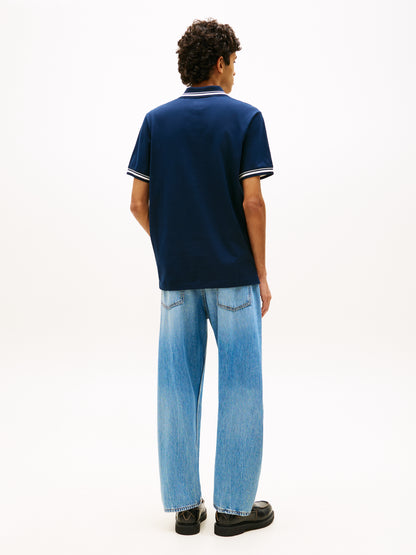 POLO BLU TOMMY JEANS CON FLAG LOGATA DA UOMO