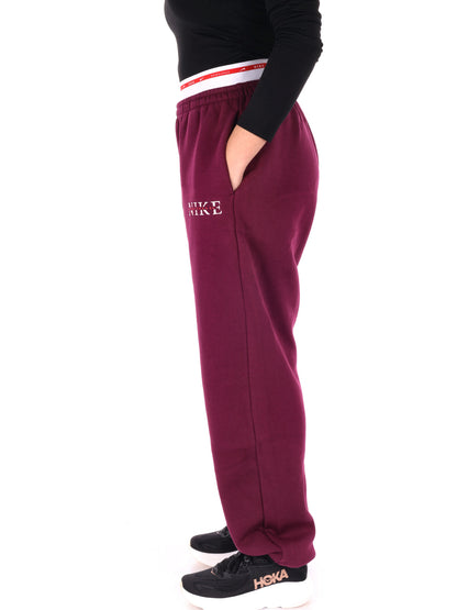 PANTALONE TUTA A VITA ALTA NIKE DA DONNA BORDEAUX